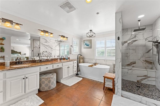 bathroom featuring tile patterned floors, vanity, crown molding, tile walls, and independent shower and bath