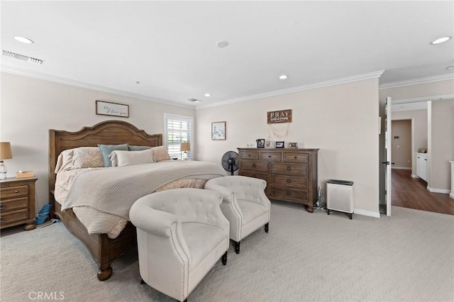 bedroom with crown molding and light carpet