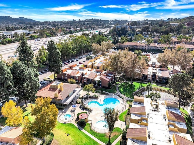 birds eye view of property with a mountain view