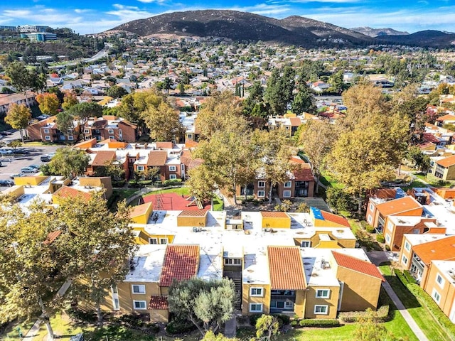 birds eye view of property with a mountain view