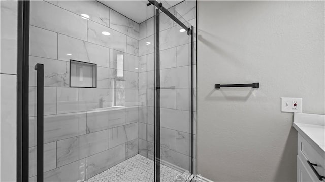 bathroom featuring vanity and walk in shower