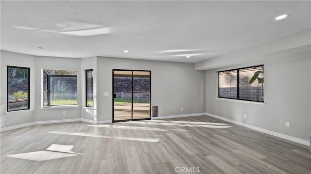 unfurnished room featuring light hardwood / wood-style flooring