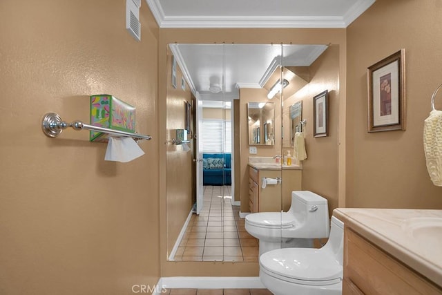 bathroom with tile patterned flooring, vanity, toilet, and crown molding