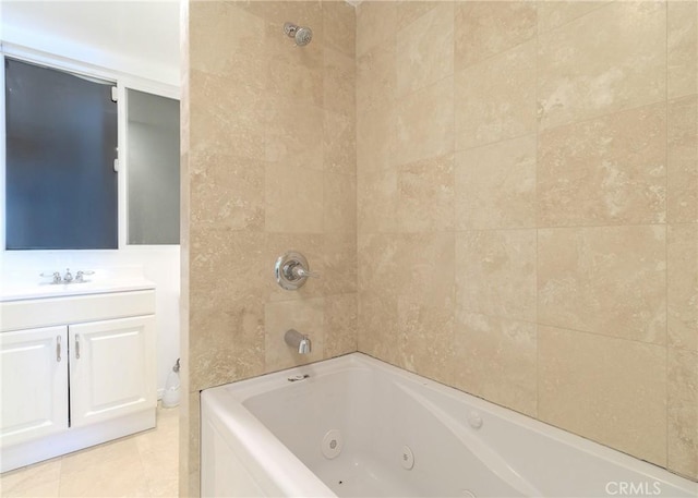 bathroom with vanity and tiled shower / bath