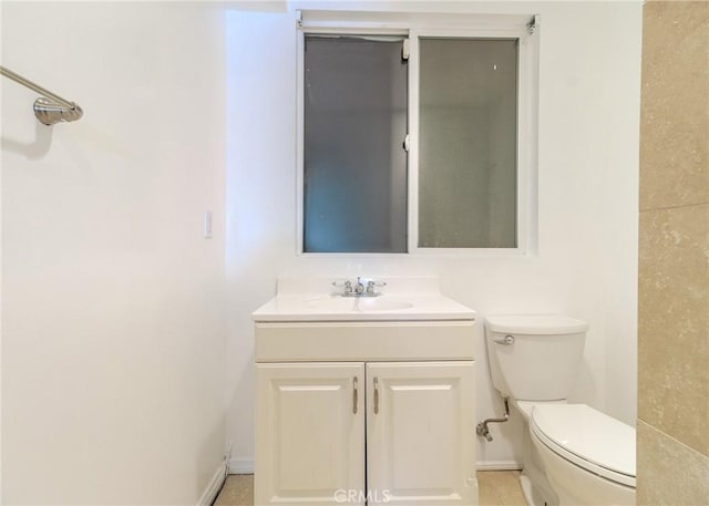 bathroom with toilet and vanity