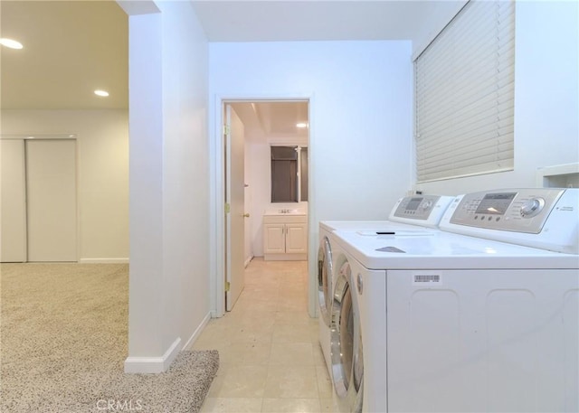 laundry area with sink and separate washer and dryer