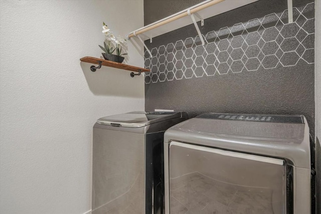 washroom with washer and clothes dryer