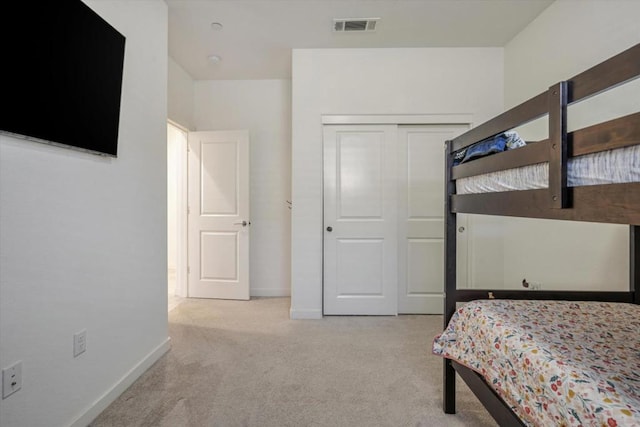 carpeted bedroom featuring a closet