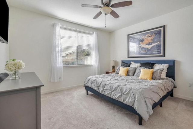 bedroom featuring light carpet and ceiling fan