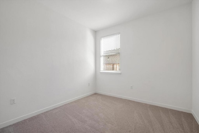 unfurnished room with carpet flooring