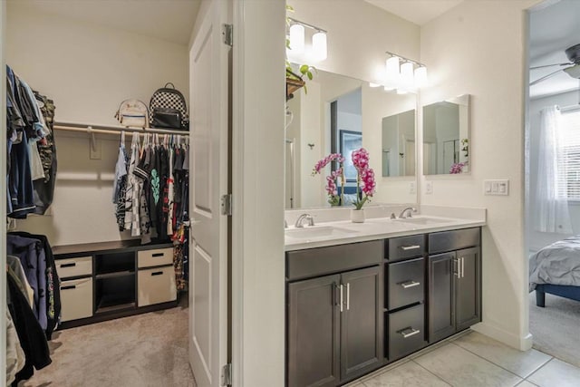 bathroom featuring vanity, tile patterned floors, and ceiling fan