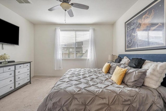 bedroom featuring light carpet and ceiling fan