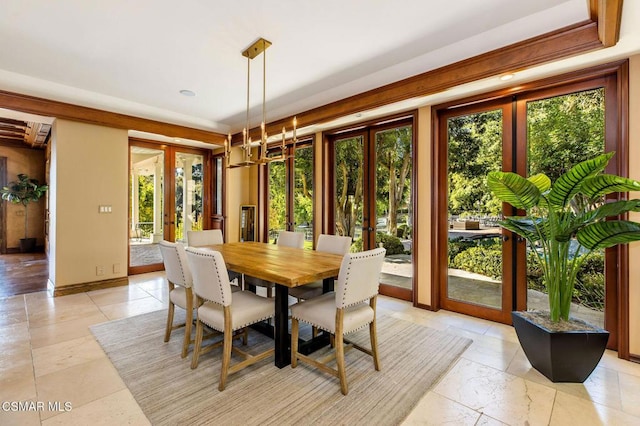 dining room featuring french doors and plenty of natural light