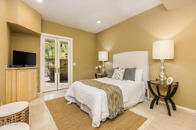 bedroom featuring access to outside and french doors