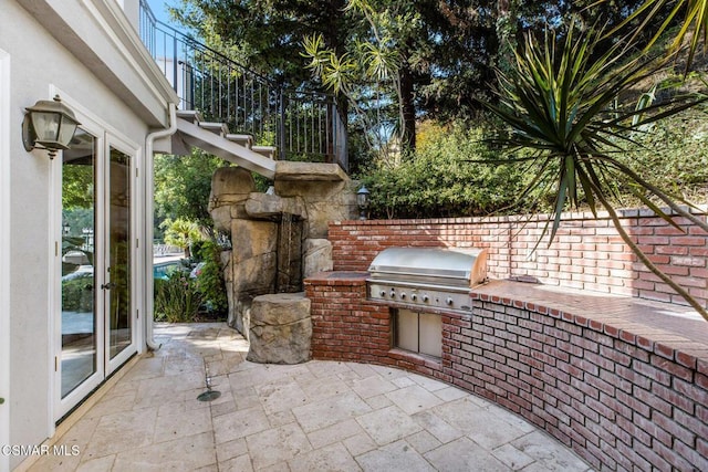 view of patio with a grill and area for grilling