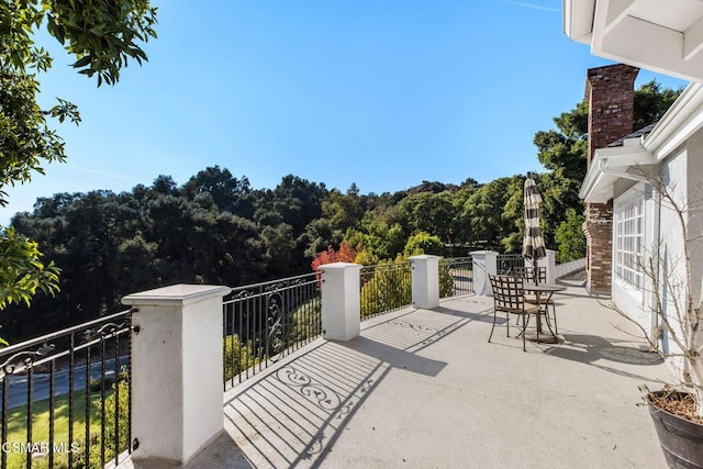 view of patio featuring a balcony