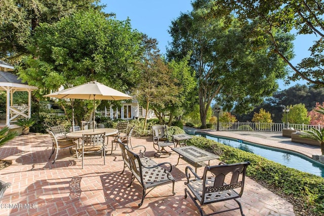 view of patio / terrace featuring a fenced in pool