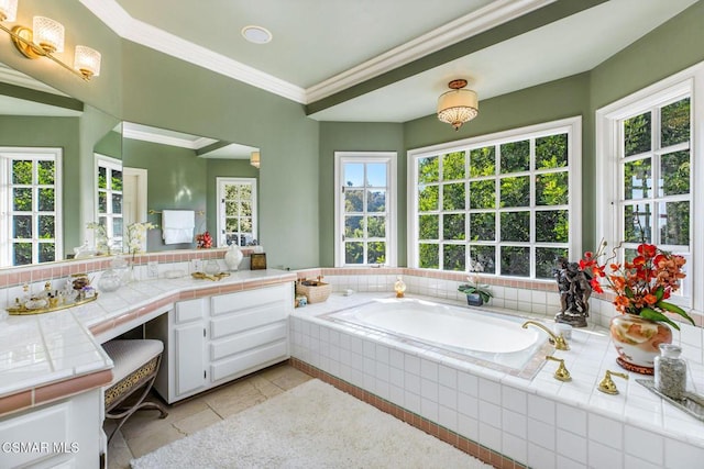 bathroom featuring vanity, tasteful backsplash, tile patterned floors, and tiled tub