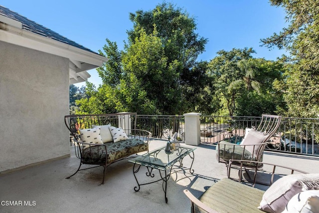 view of patio / terrace with outdoor lounge area and a balcony