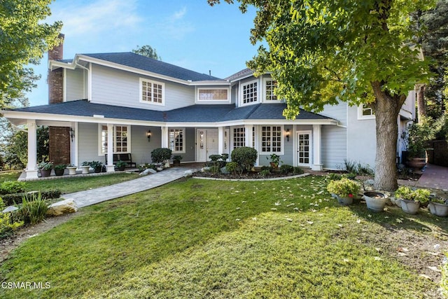 view of front facade with a porch and a front yard