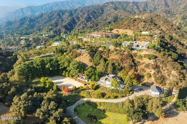 birds eye view of property with a mountain view