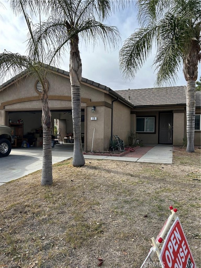 single story home featuring a garage