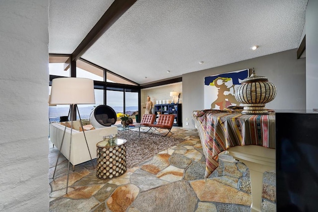 living room featuring a textured ceiling and lofted ceiling with beams