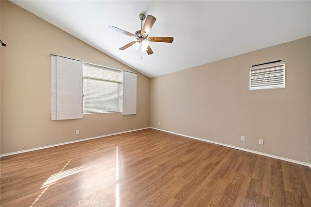 unfurnished room with wood-type flooring, vaulted ceiling, and ceiling fan