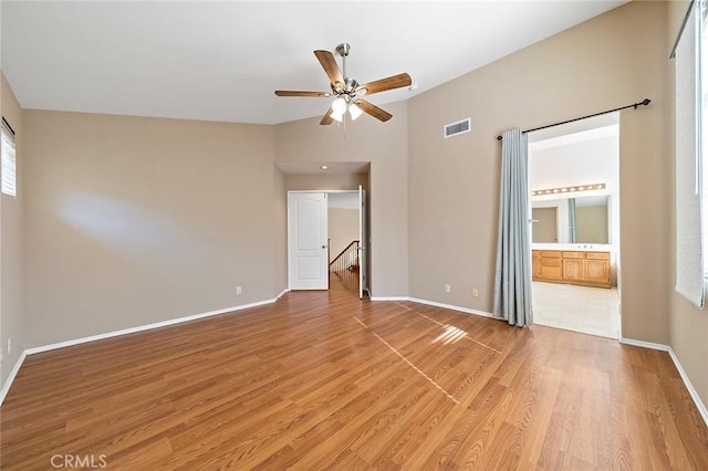 empty room featuring wood-type flooring and ceiling fan