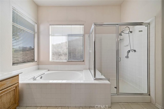 bathroom with tile patterned flooring, vanity, and independent shower and bath