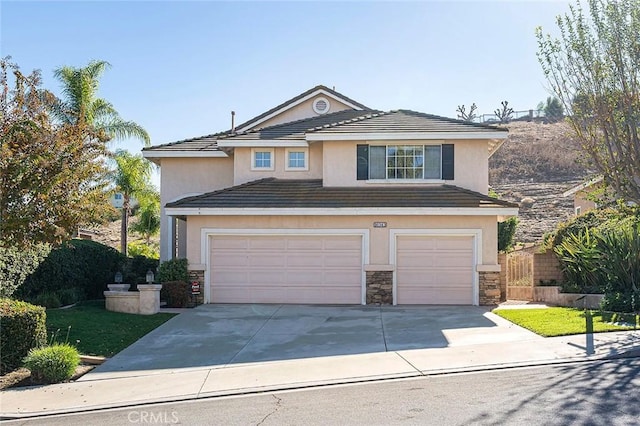 front of property with a garage