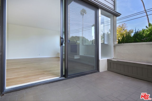 doorway to property featuring a patio area