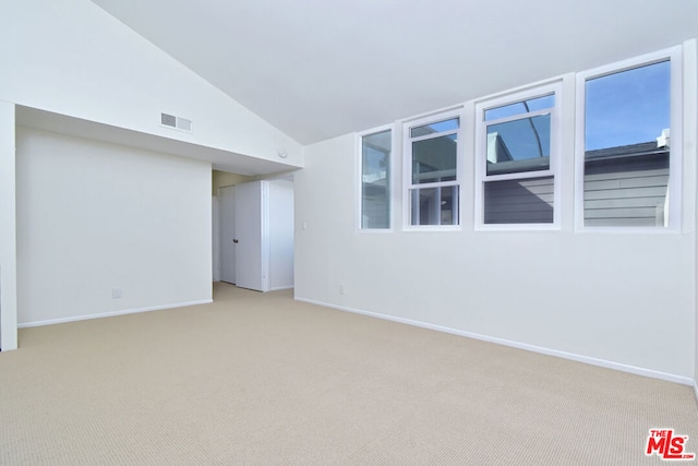 basement featuring light carpet