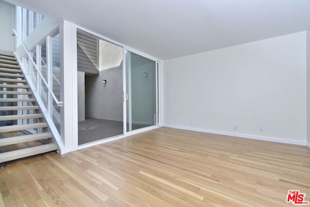 unfurnished living room with light hardwood / wood-style floors