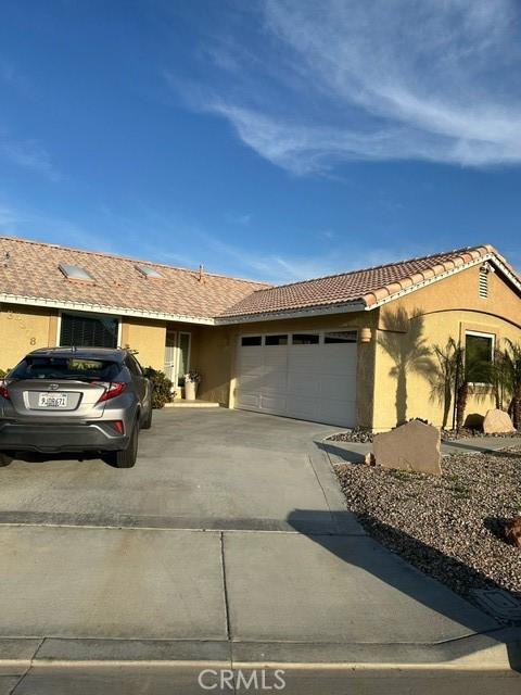 ranch-style home featuring a garage