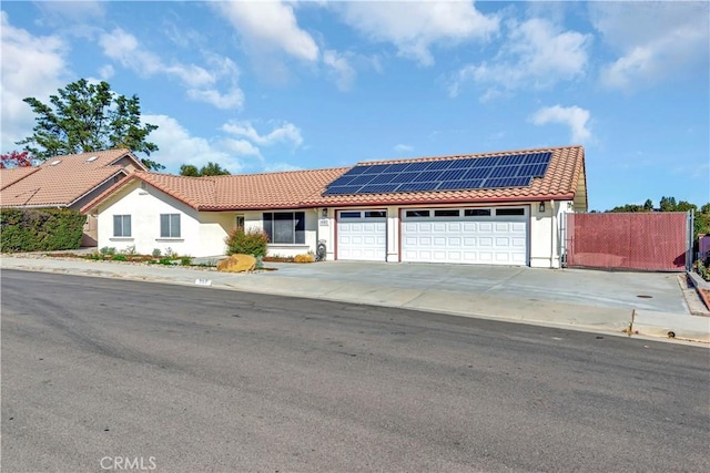 view of front of house featuring solar panels