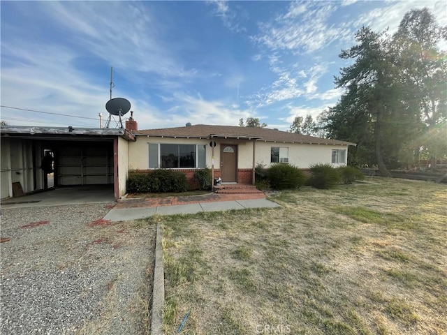 single story home with a garage