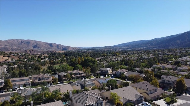 birds eye view of property featuring a mountain view