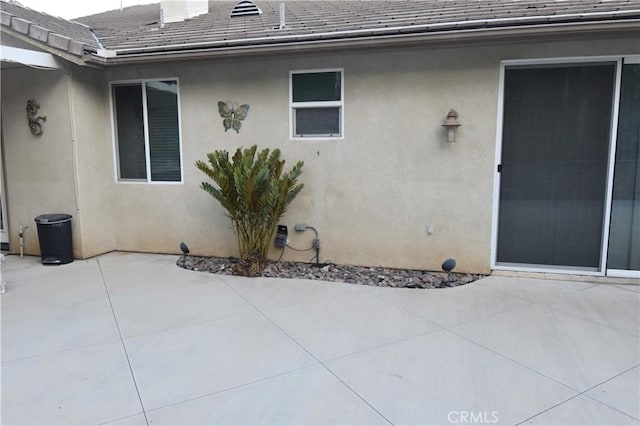 property entrance with a patio area