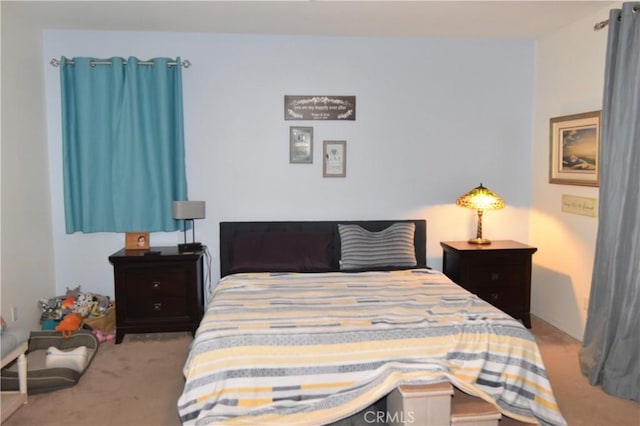 bedroom featuring light carpet