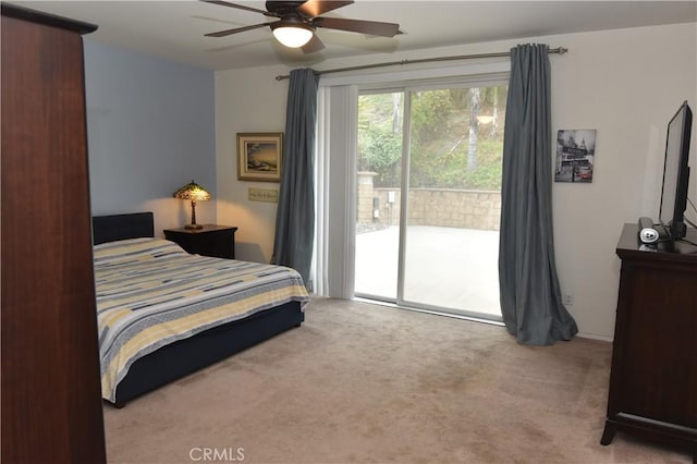 bedroom with access to exterior, light carpet, and ceiling fan