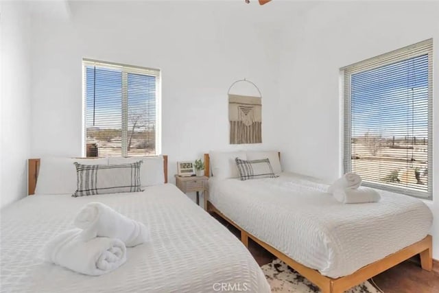 bedroom featuring multiple windows