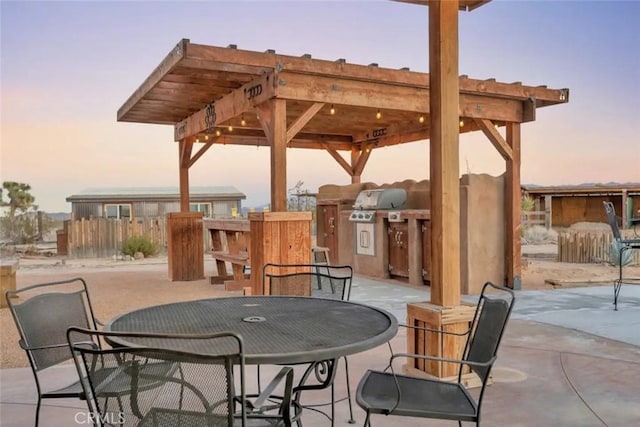 patio terrace at dusk with a pergola