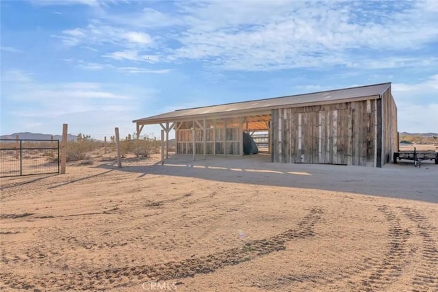 surrounding community with a rural view and an outbuilding