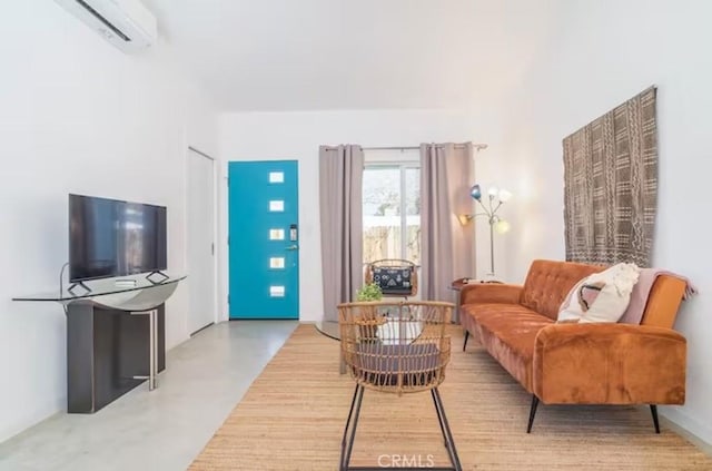 living area with a wall unit AC