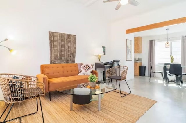 sitting room featuring ceiling fan