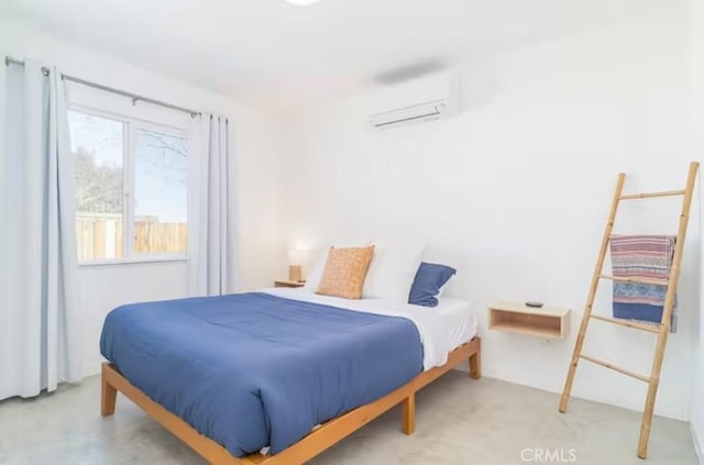 bedroom with an AC wall unit