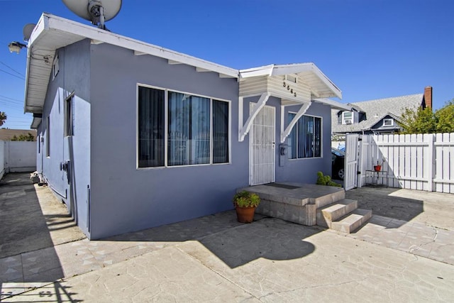 back of house with a patio area