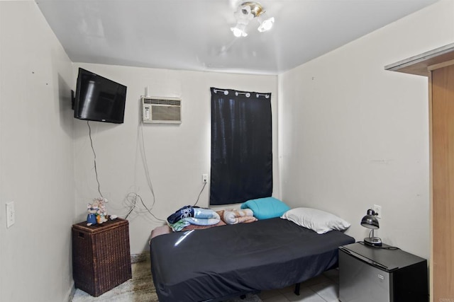 bedroom with an AC wall unit