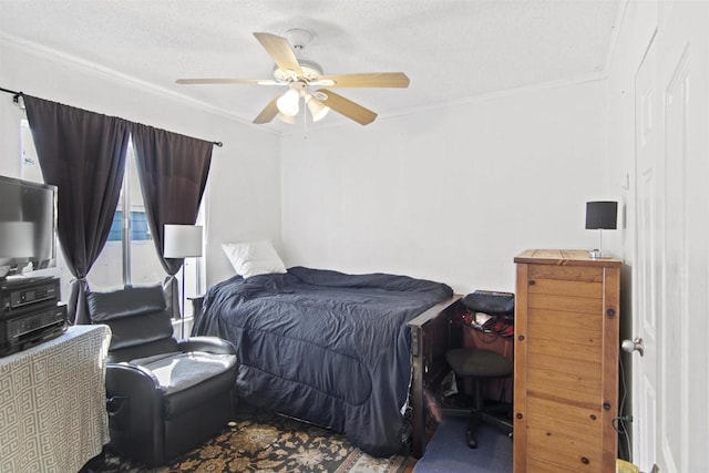 carpeted bedroom with ceiling fan, crown molding, and a textured ceiling